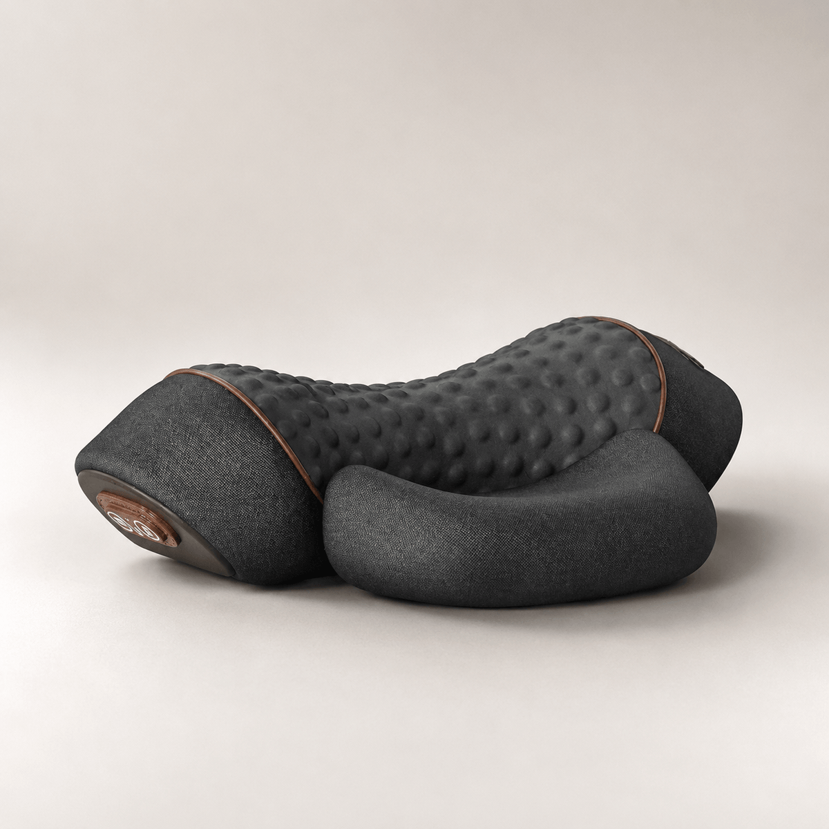Black Thera Pillow heated neck traction massager on a neutral background